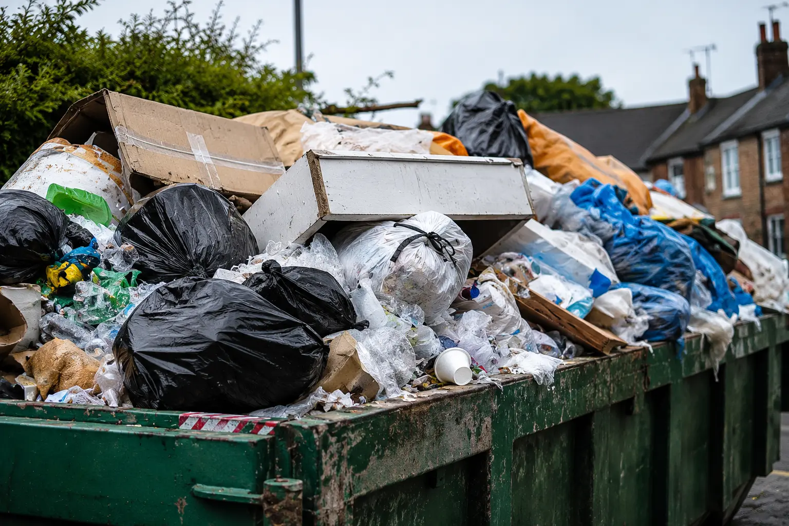 Overflowing dumpster in urban setting Dubai